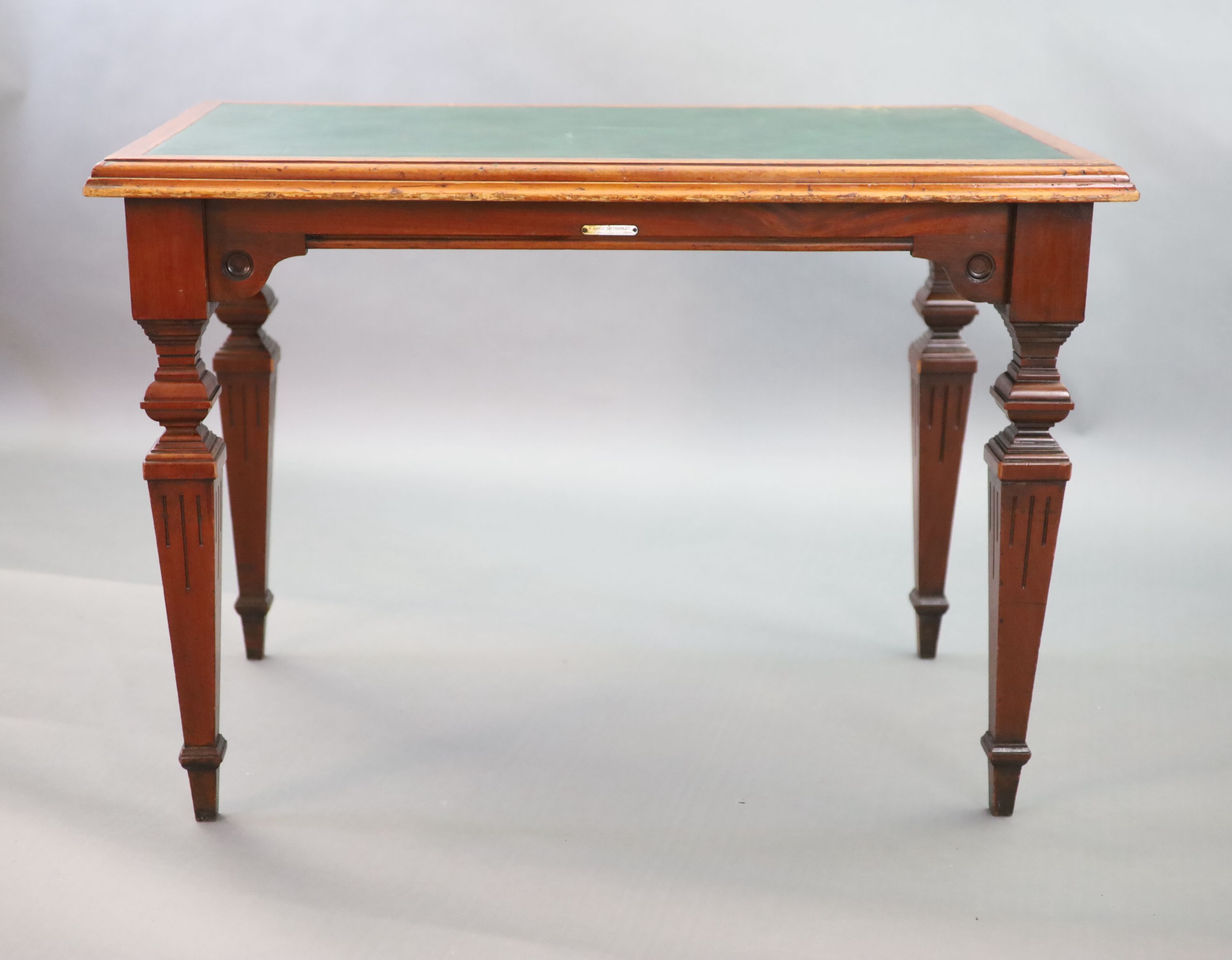 A Victorian mahogany writing table, supplied by Sage & Co. Shopfitters of London, W.112cm D.68cm H.79cm